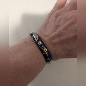 Blue and Gold Dolphin Bracelet With Blue Enamel. Clamped Style. Spring Hinge.